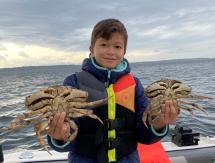 Boy with Dungeness crab