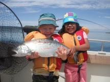 Youth holding Salmon in Puget Sound