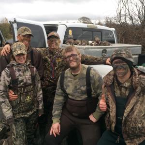 Group of hunters after successful duck hunt