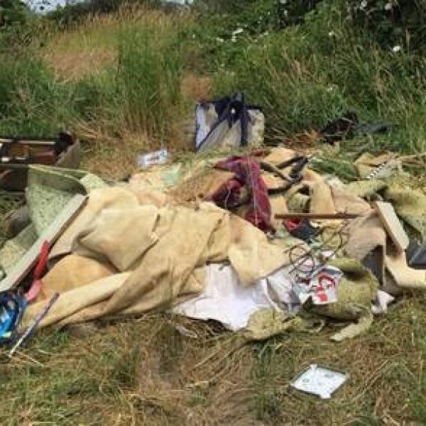 Pile of garbage dumped at water access site